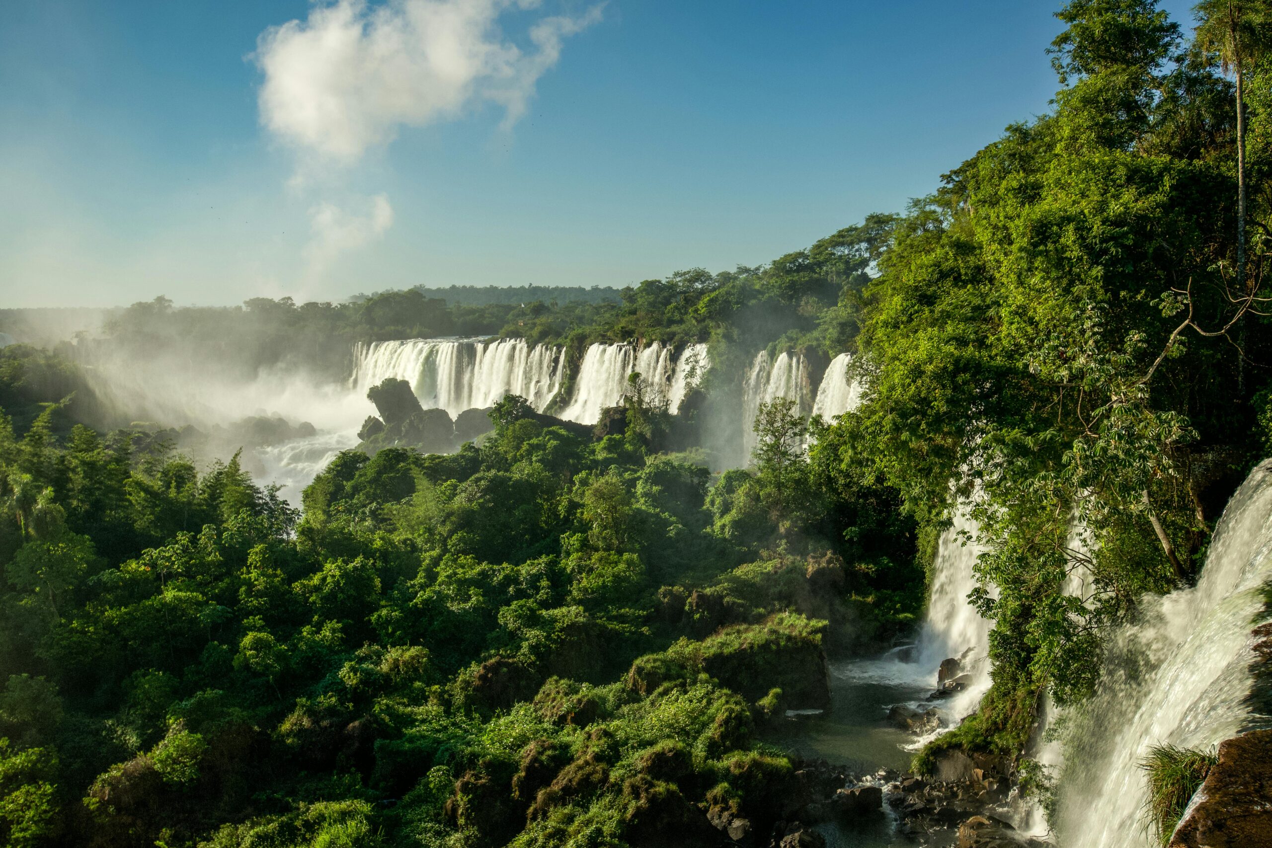 Stunning view of Iguazu Falls cascading through lush rainforest in Misiones, Argentina.
